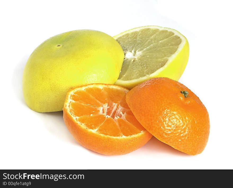 Grapefruit and orange halves isolated on the white background.