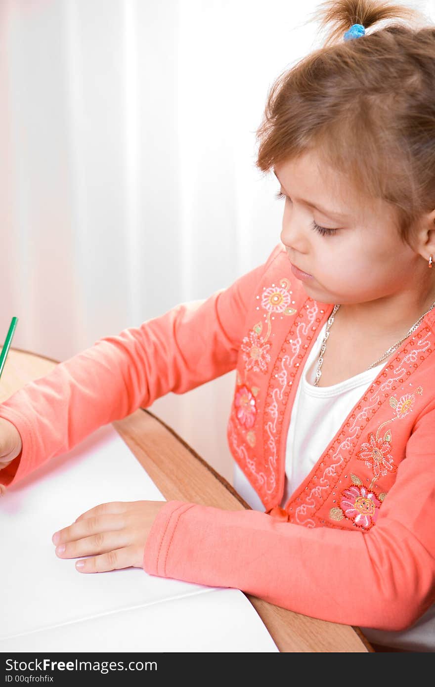 Pretty caucasian child paint . Close-up