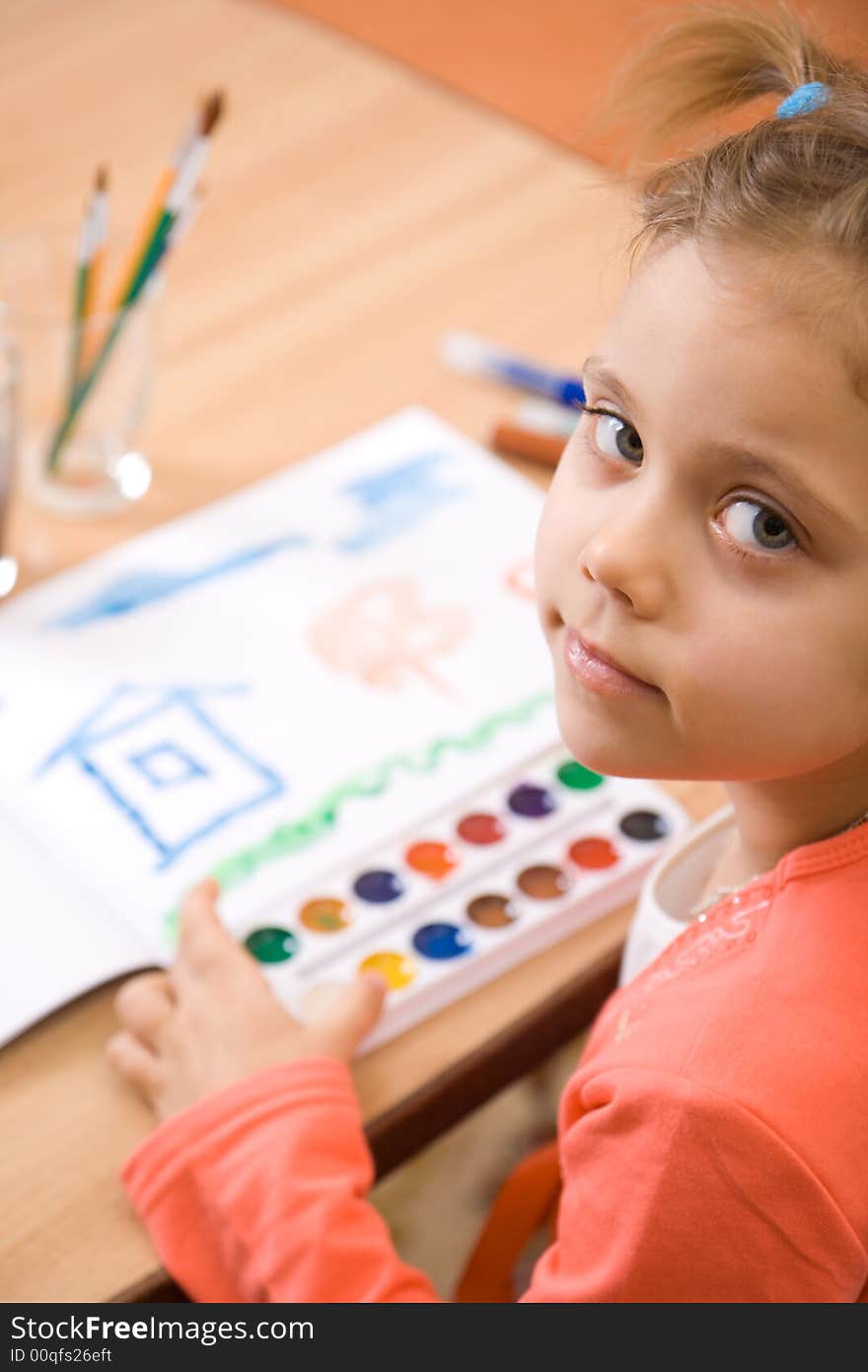 Pretty caucasian girl watercolor paint . Close-up. Pretty caucasian girl watercolor paint . Close-up