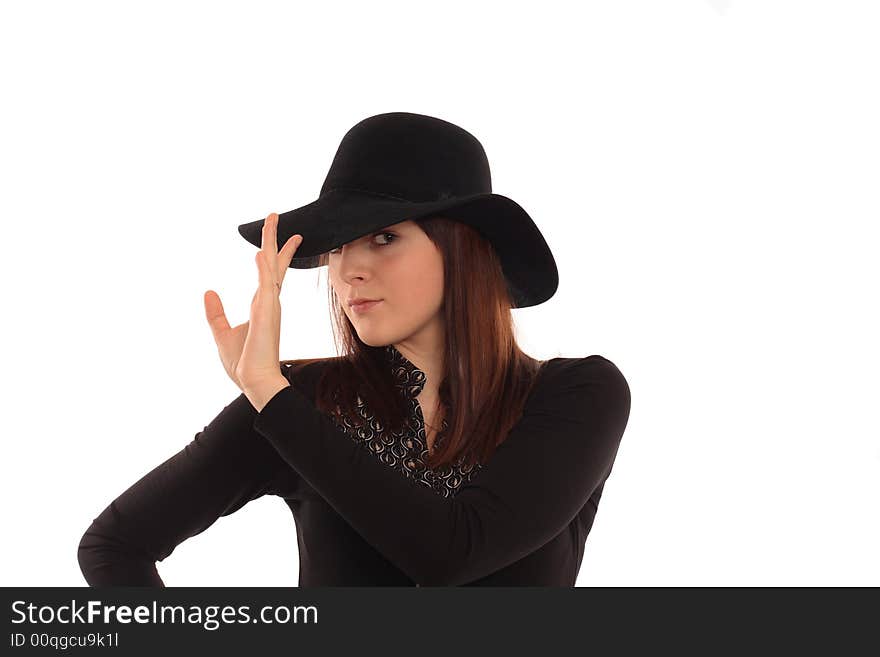 Portrait of the girl in a black hat. Isolated