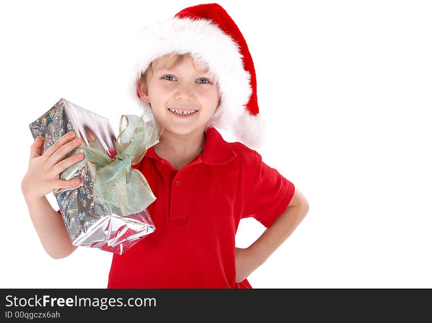 A young boy dressed up as Santa Claus, holding a present. White background. A young boy dressed up as Santa Claus, holding a present. White background.