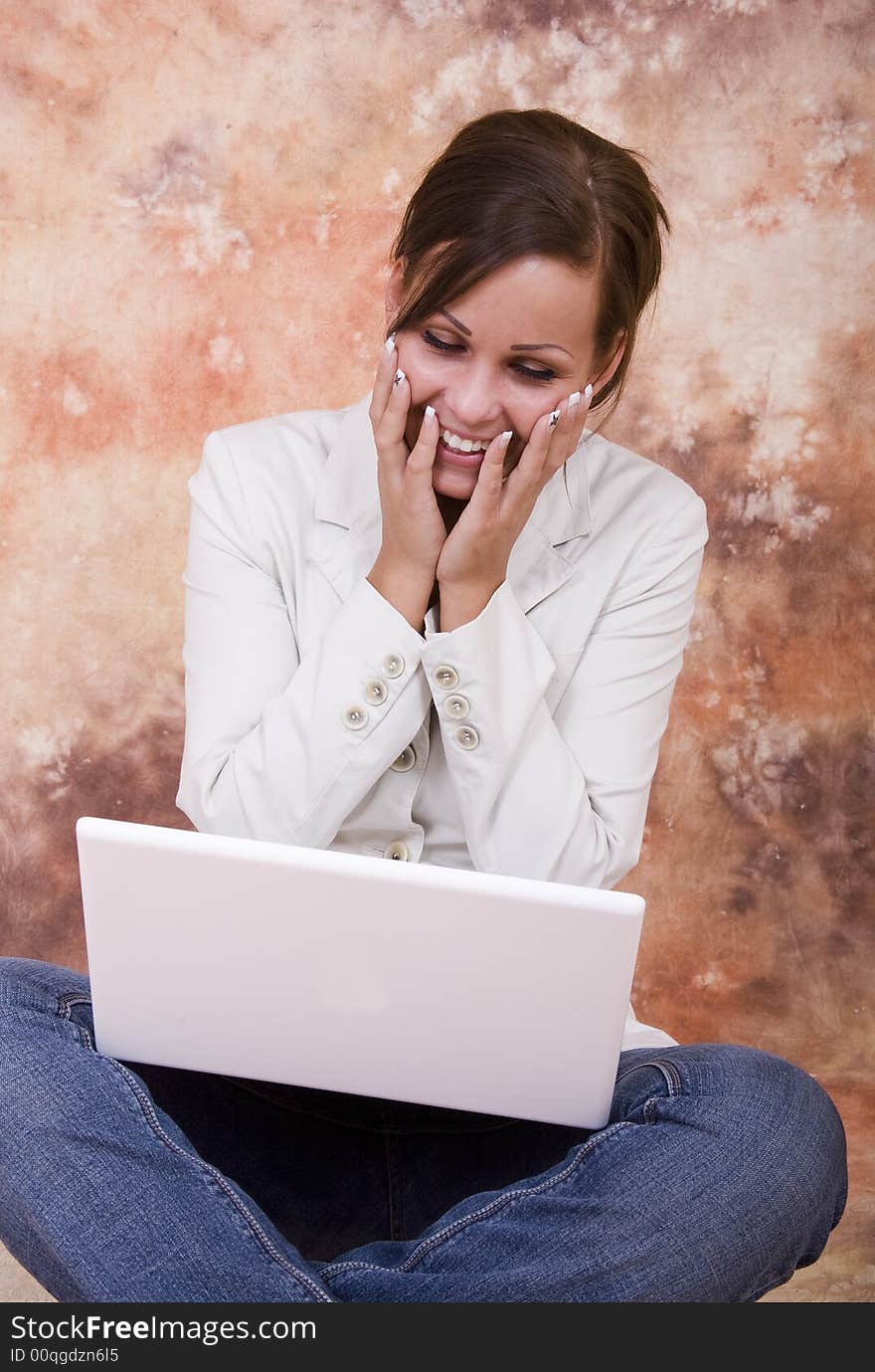 Happy girl with white laptop computer. Happy girl with white laptop computer