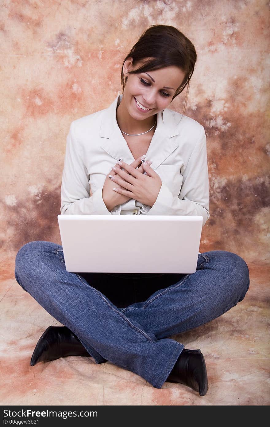 Happy girl with white laptop computer. Happy girl with white laptop computer