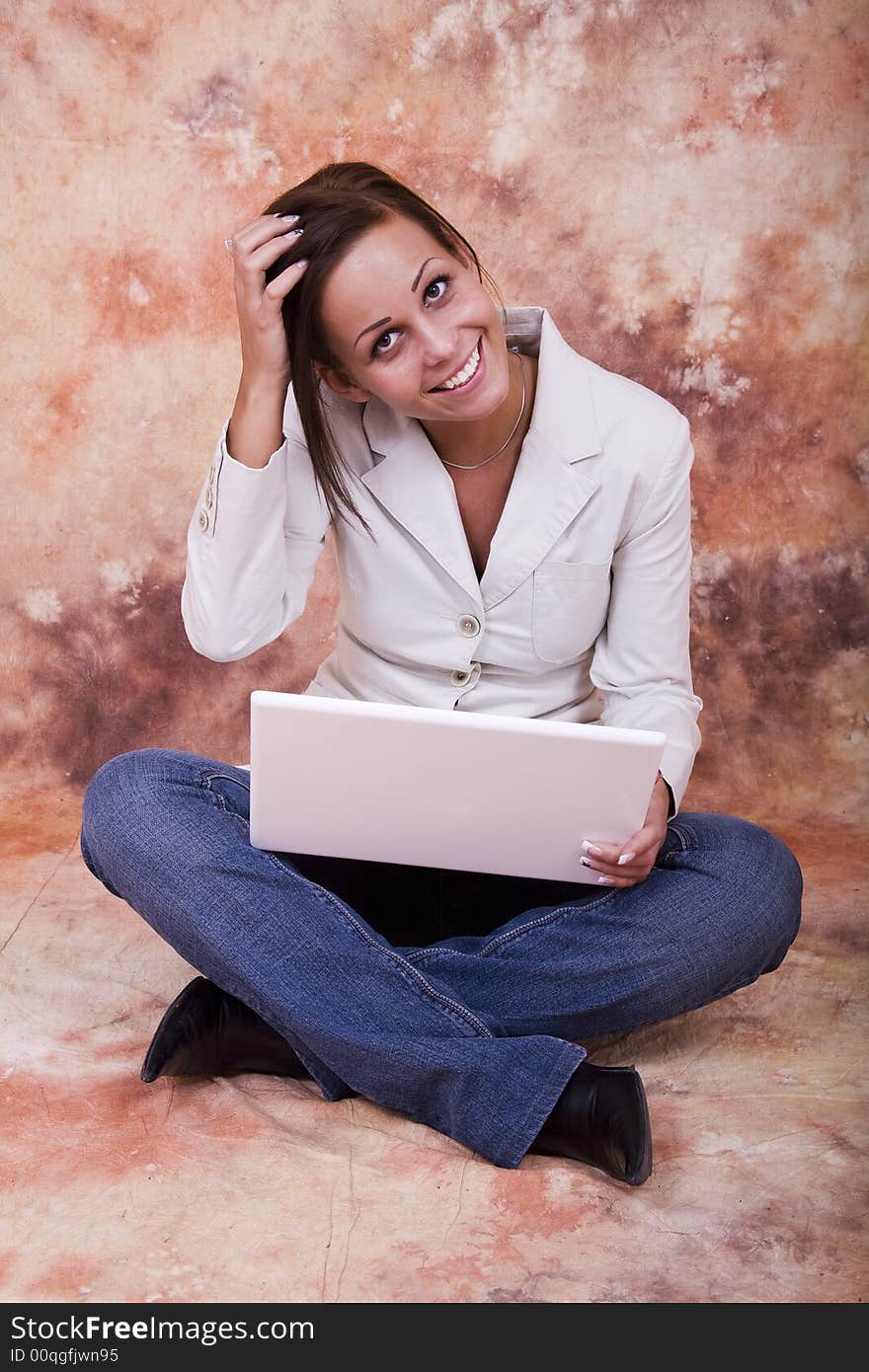 Happy girl with white laptop computer. Happy girl with white laptop computer