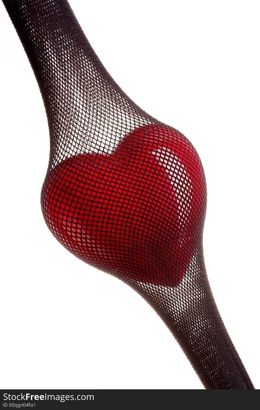 Red heart inside of the stretched stocking in a grid. Red heart inside of the stretched stocking in a grid