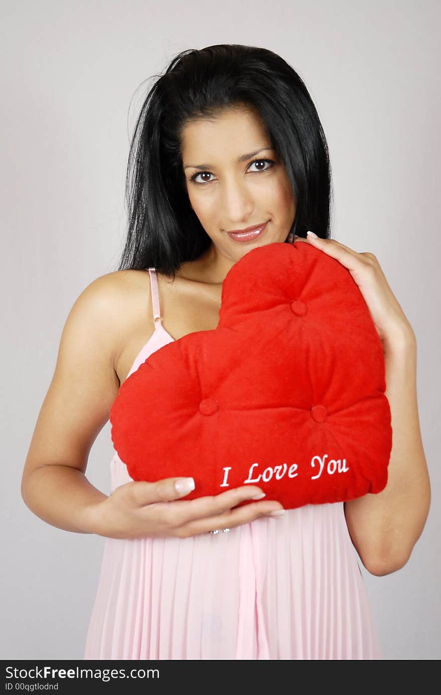 Pretty Indian Girl holding Valentine Heart.