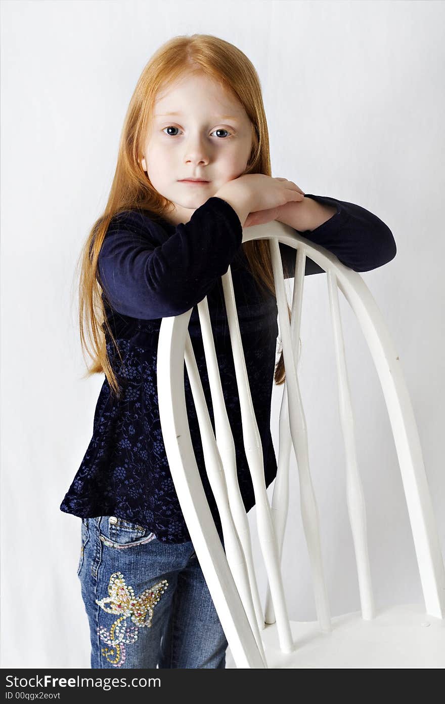 A beautiful young girl with long red hair. A beautiful young girl with long red hair.