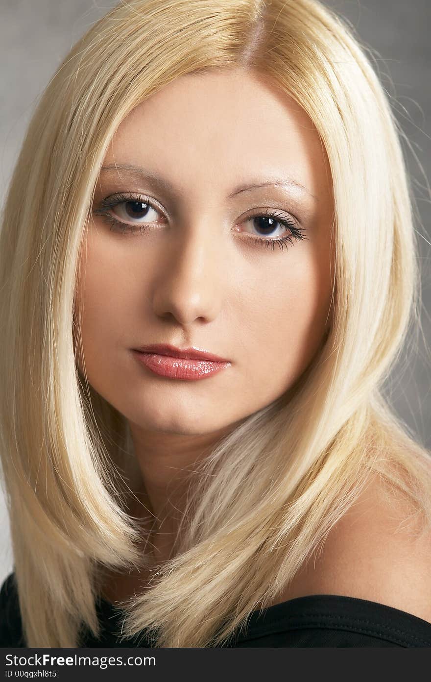 Close up of a Glamor girl posing on a grey background