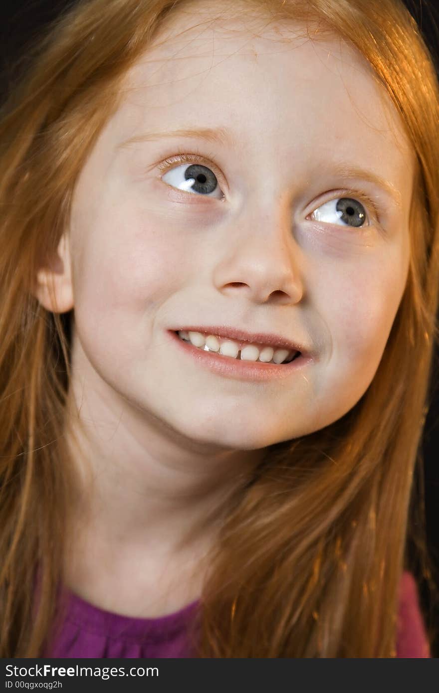 A young girl with beautiful long red hair. A young girl with beautiful long red hair.