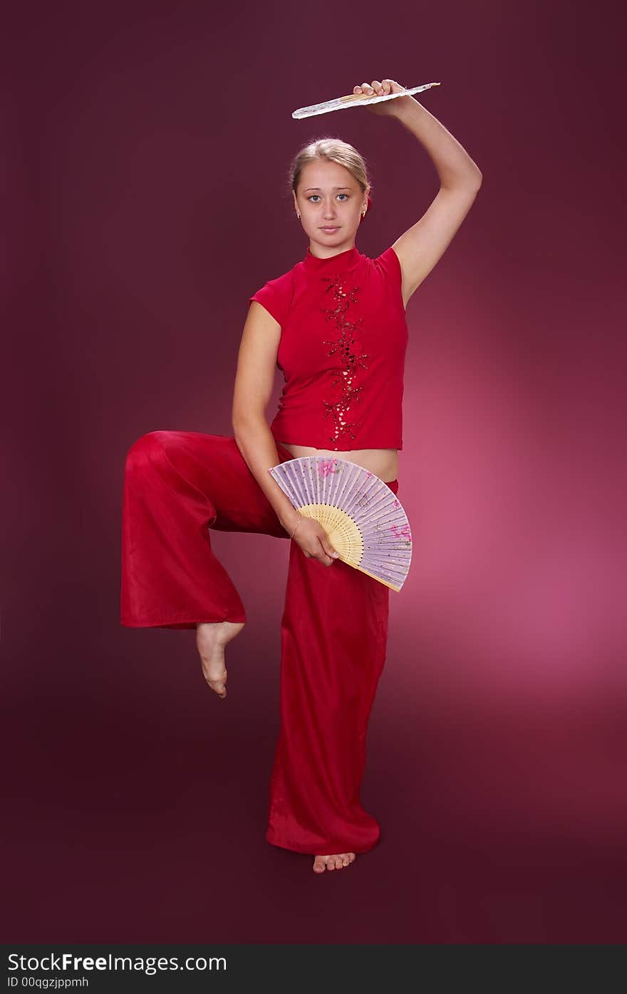 Dancing with fans on a red background