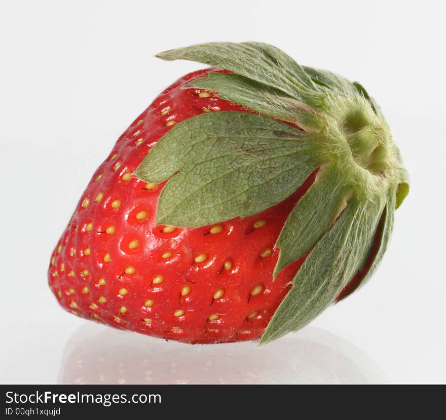 This single strawberry ready to be trimmed and eaten