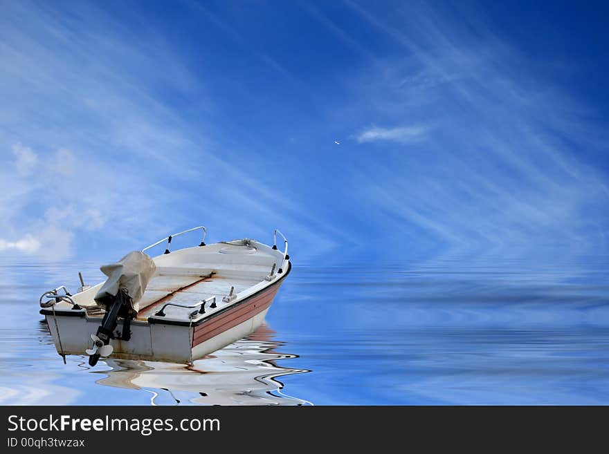 A small boat floating on a calm sea. A small boat floating on a calm sea