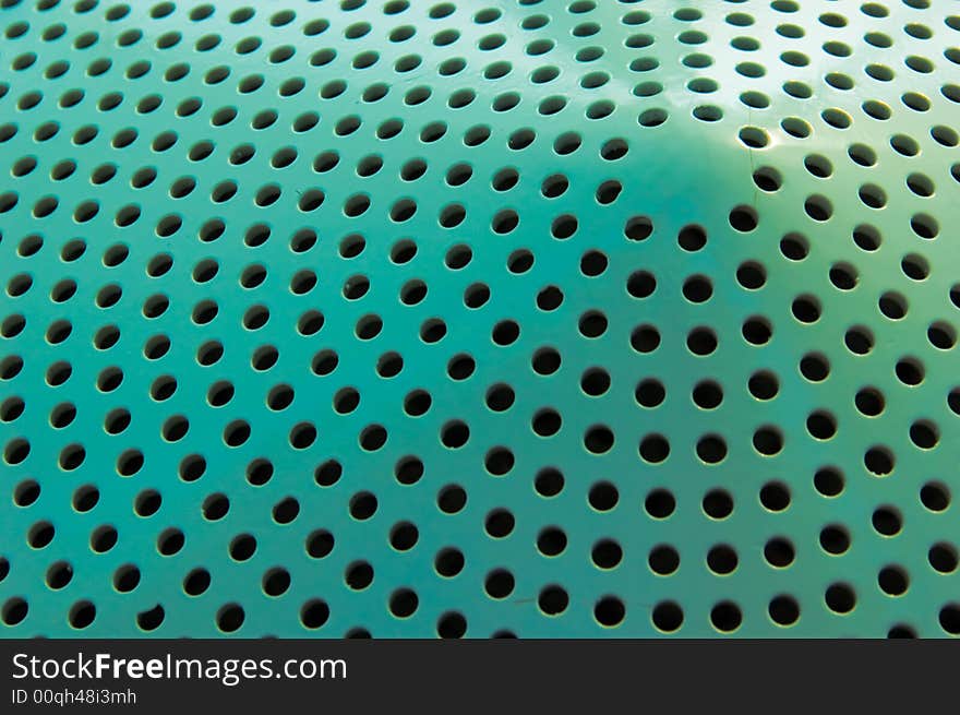 Green pattern of holes in a conical form. Green pattern of holes in a conical form