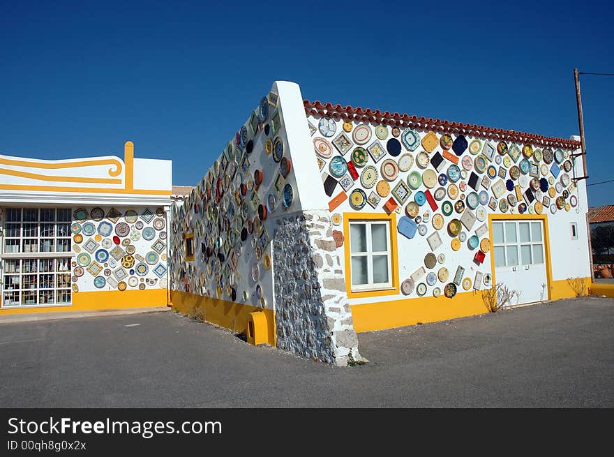 White and yellow house of Portugal, the wall decorate in ceramics, Algarve region