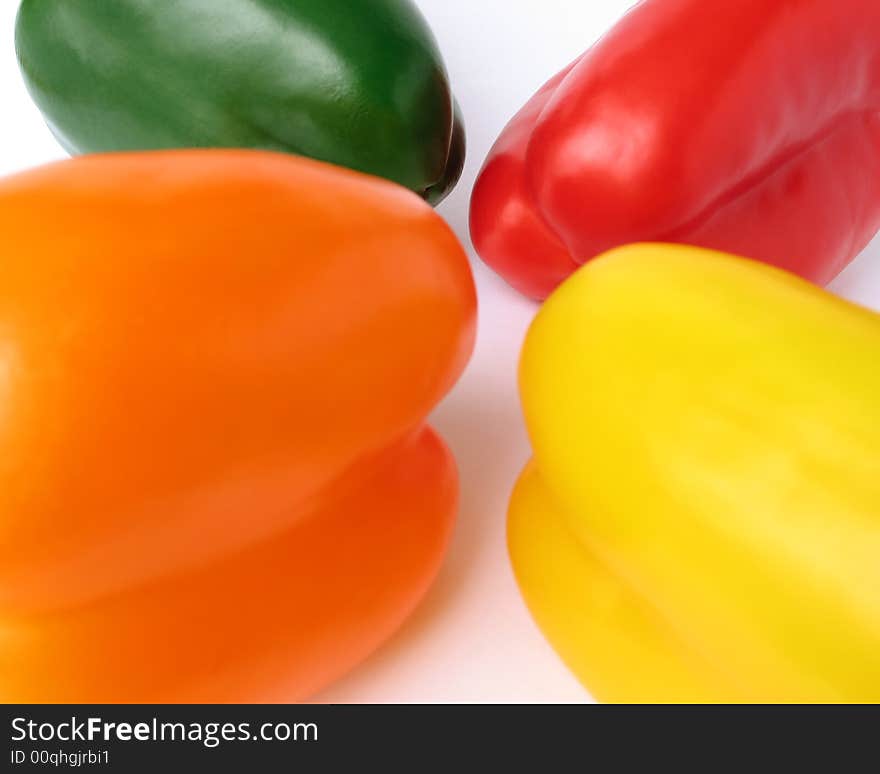 Four multiple colored peppers