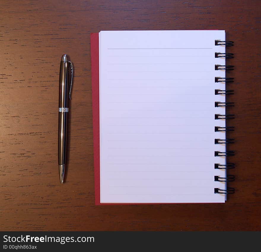 Open notebook with pen