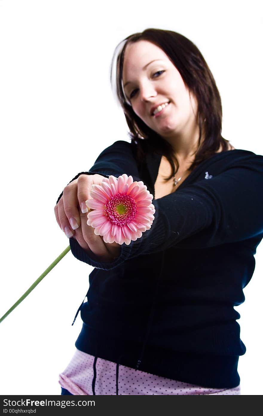 Young woman with blue eyes holding a pink flower. Young woman with blue eyes holding a pink flower.