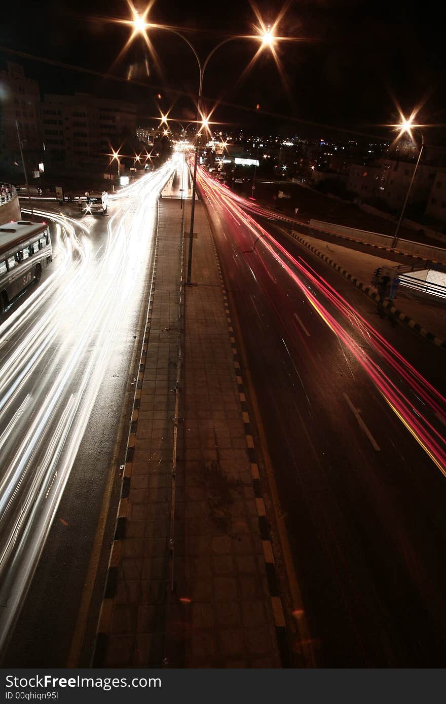 Picture of a road lit up by car lights. Picture of a road lit up by car lights