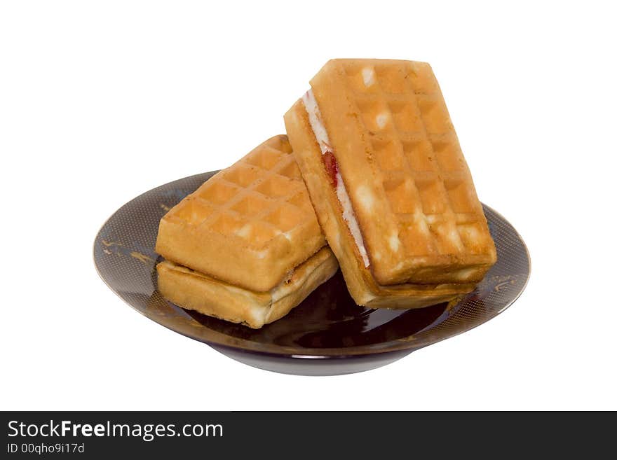 Two cakes on plate on white background with path