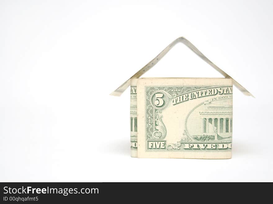 House made from dollar bills on light background. House made from dollar bills on light background