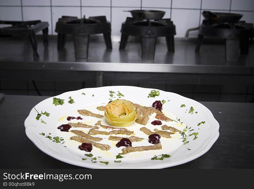 Delicacy of meat, yogurt and jam served on a white plate. Delicacy of meat, yogurt and jam served on a white plate.