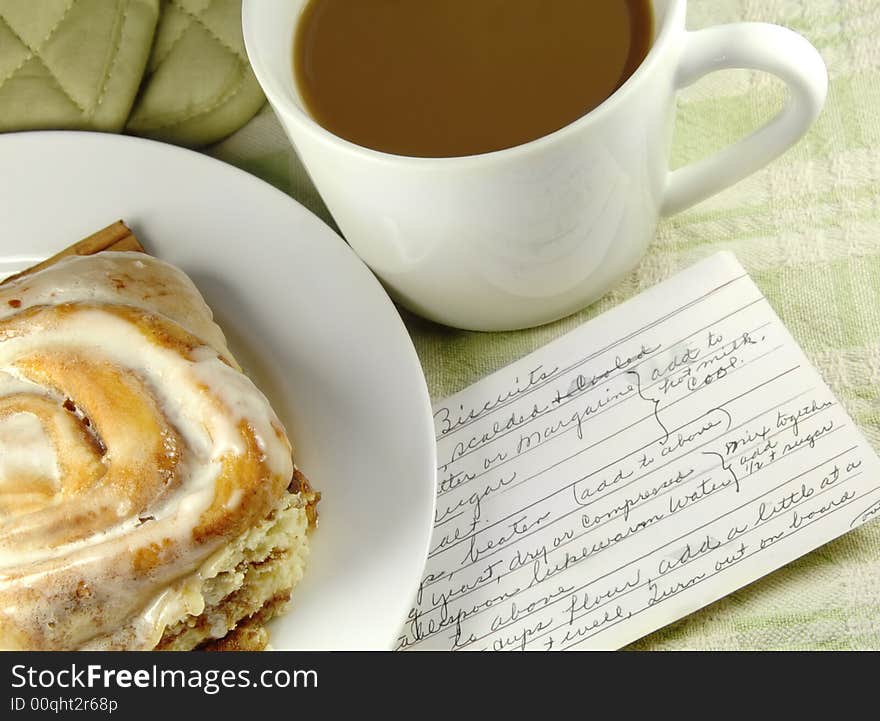 Cinnamon Roll with Recipe and a cup of coffee. Cinnamon Roll with Recipe and a cup of coffee.