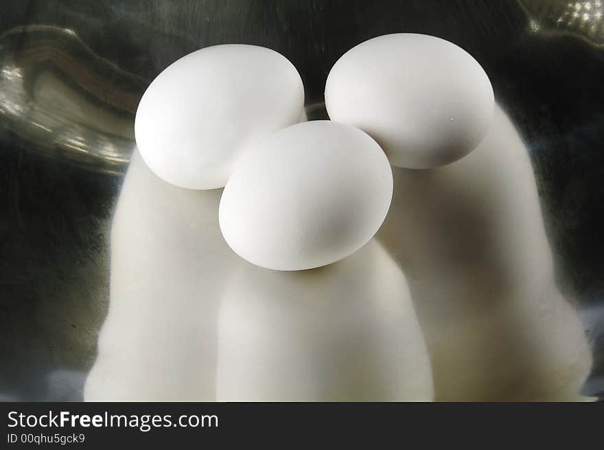 Three Eggs in a Metal Dish