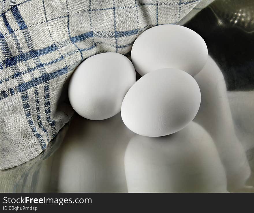 Three Eggs In A Metal Dish