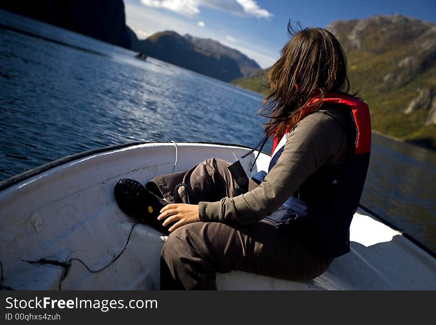 Young woman in small boat