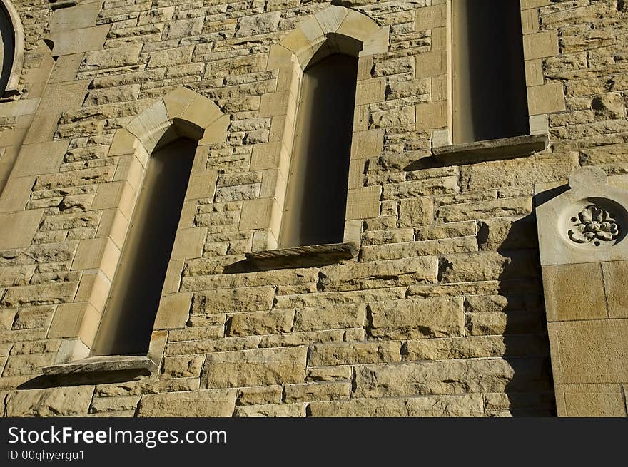 Closeup of Church with windows and sandstone texture