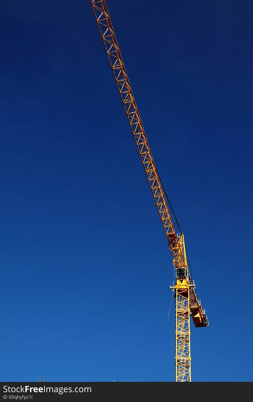 Yellow crane on blue sky