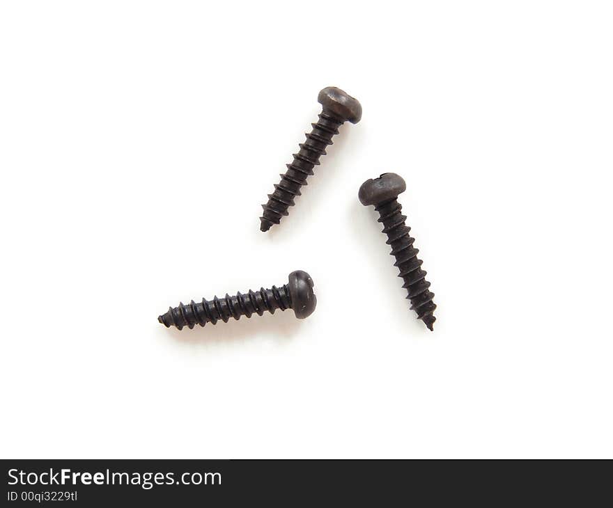 Three black screws isolated on white background