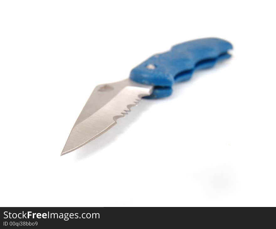 Small silver metal pocket knife with blue handle over white