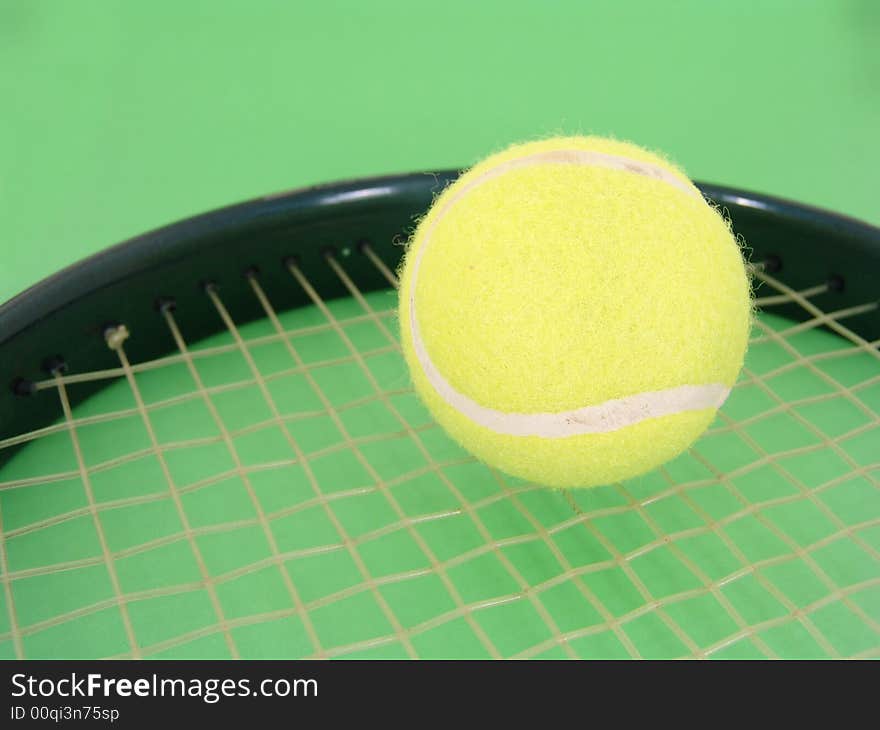 Tennis ball and racket