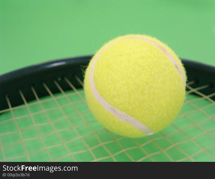 Tennis ball and racket