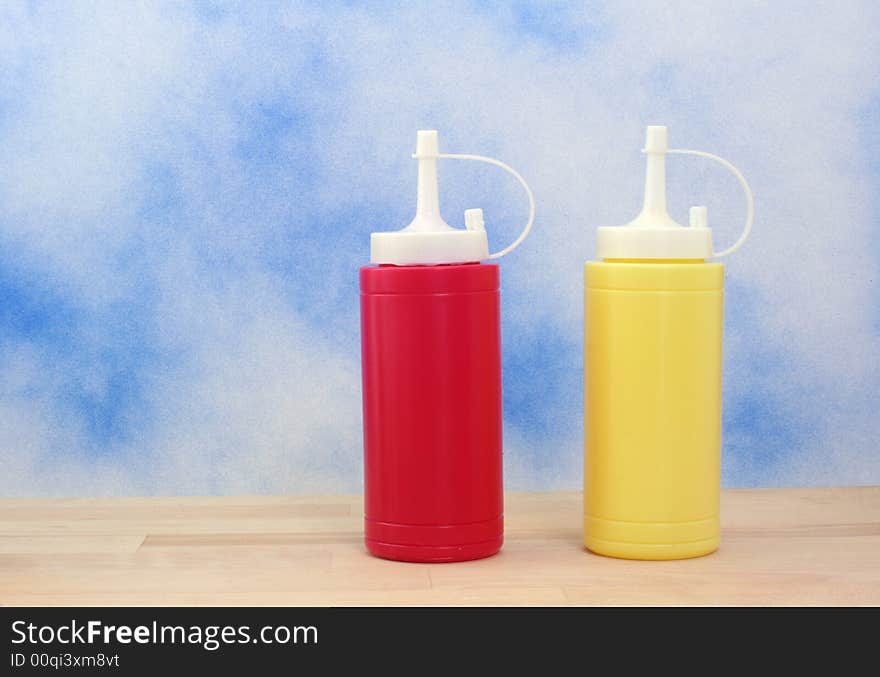 Ketchup and Mustard on Blue Textured Background