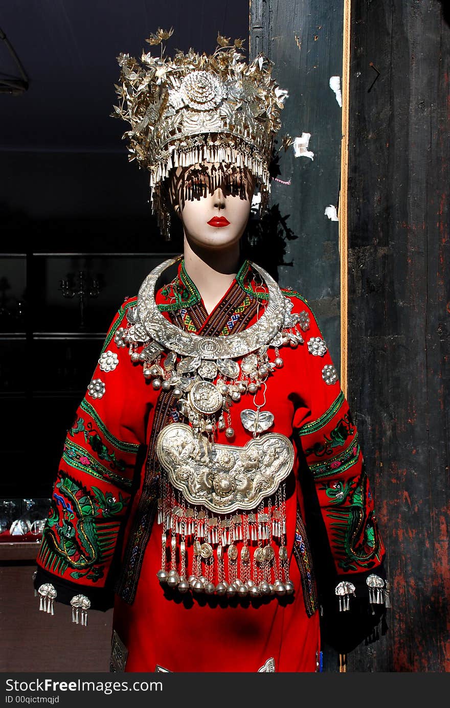 a plastic model covered, hanged with chinese silver accouterments of the local Naxi ethnic people,Shuhe Town,Lijiang,Yunnan,China,Asia