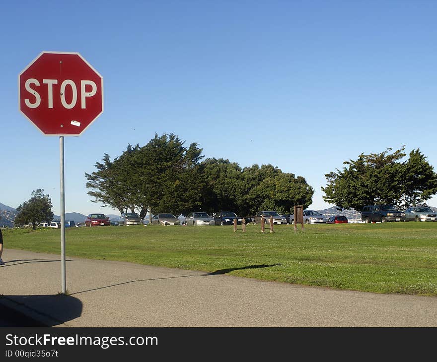 Red stop sign in parkland area