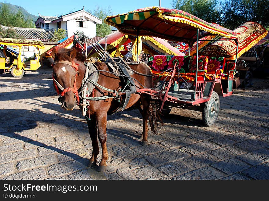 Horse-drawn cart on the flagging of Shuhe,Lijiang,Yunnan, a world Culture Heritage. Horse-drawn cart on the flagging of Shuhe,Lijiang,Yunnan, a world Culture Heritage.