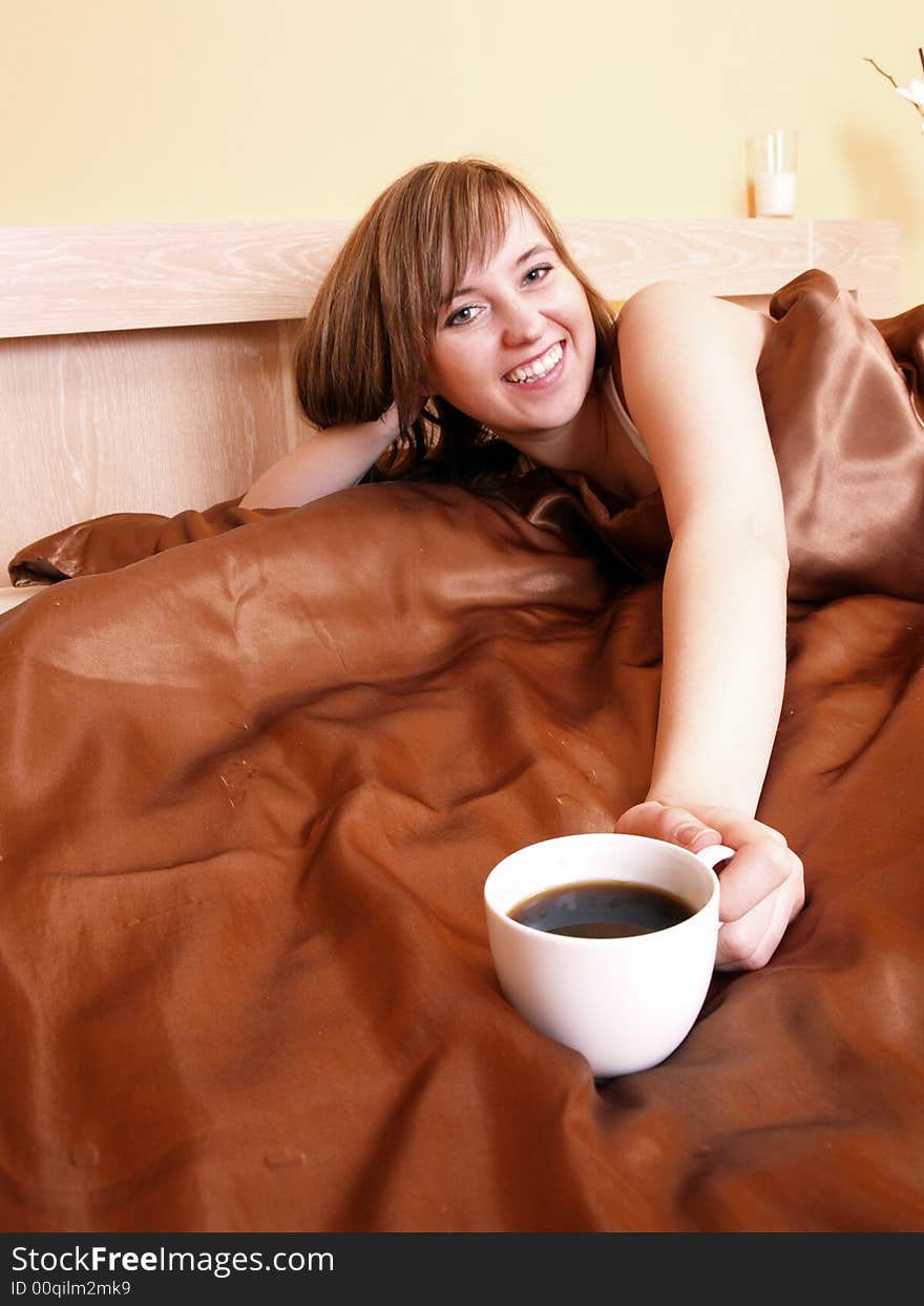 Young woman relaxing in the bedroom. Young woman relaxing in the bedroom