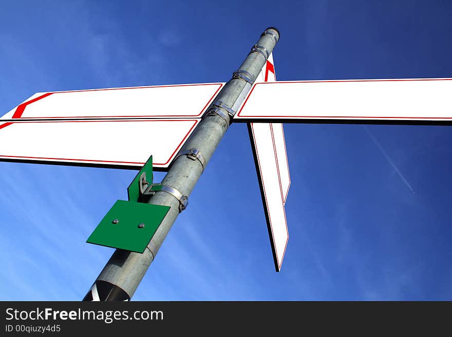 Blank white direction boards with blue sky in the background