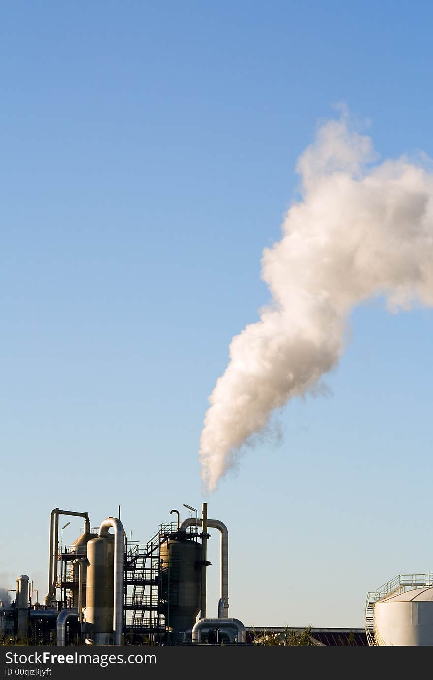 Industrial plant exhausting smokes into the atmosphere.