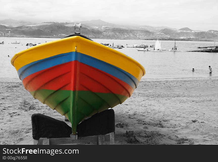 Colorful boat on the sand in a faded day. Colorful boat on the sand in a faded day