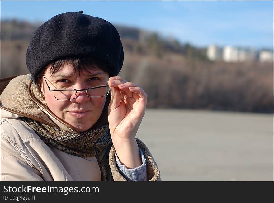 Portrait of woman in glasses looking back at the camera. Portrait of woman in glasses looking back at the camera