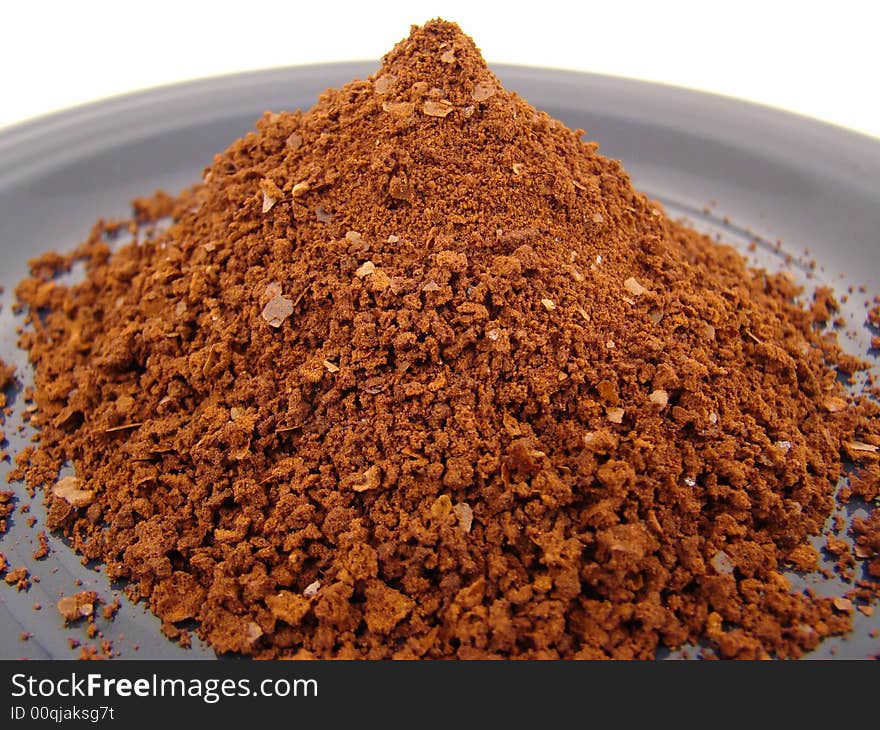 A Pile of Instant Coffee on a Blue Plate.