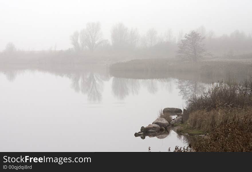 Quiet smooth surface of the river in a fog. Quiet smooth surface of the river in a fog