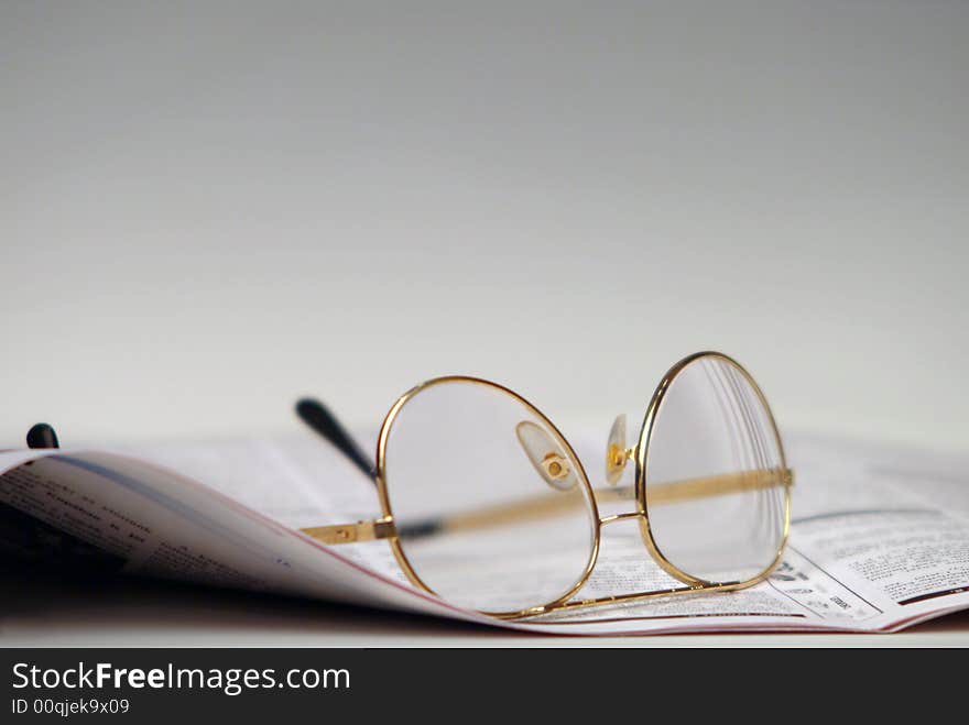 Newspaper and glasses