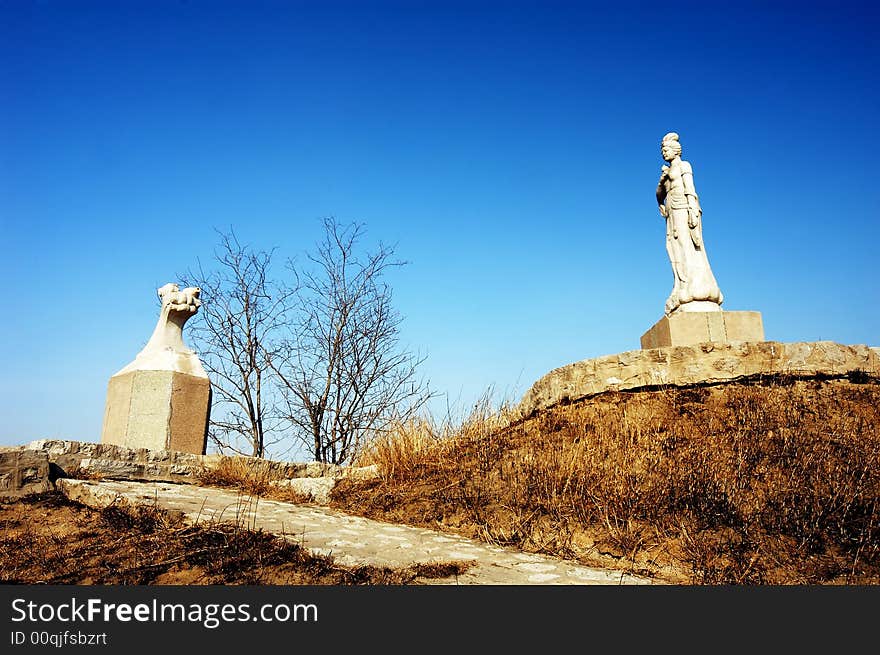 Bodhisattva statue against the blue sky