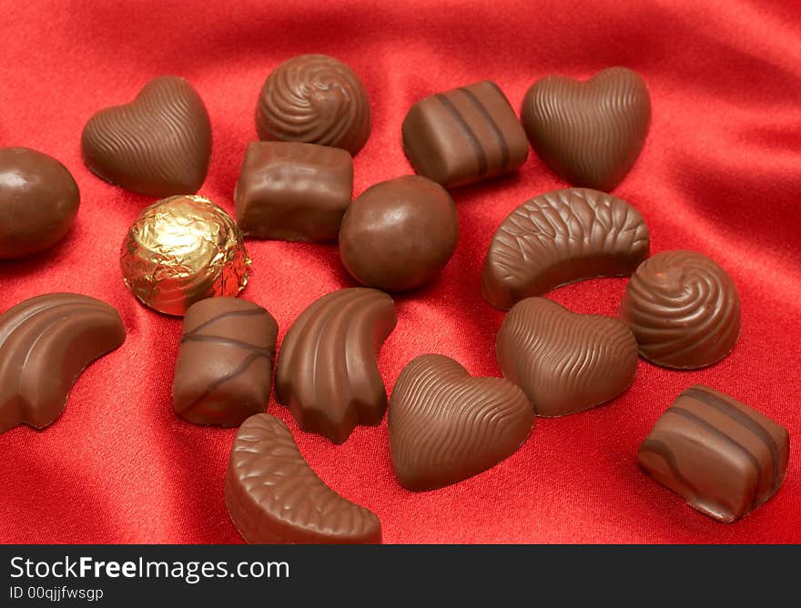 Valentines chocolates on red silk