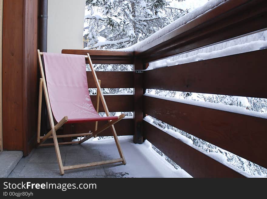 Winter deck-chair on a balcony